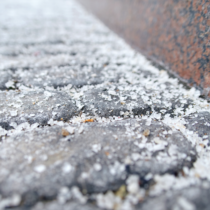 Closeup Image of Paving Slabs covered with Deicing Salt