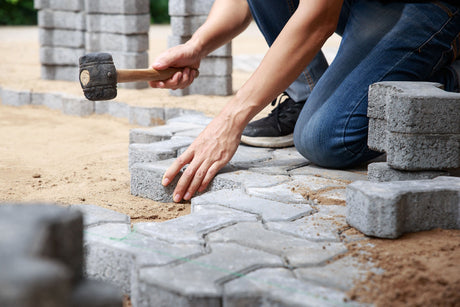 intsall & Apply Polymeric Sand to paver with mallet