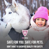 Pink Shield pet-safe ice melt promotional image with smiling child in pink hat and Siberian Husky in snowy setting