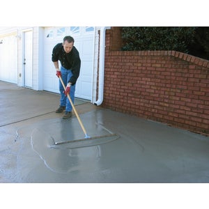 Spreading resurfacer on concrete