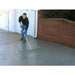 Spreading resurfacer on concrete